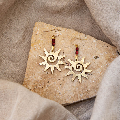 Brass Swirl Sol Earrings with Red Beads